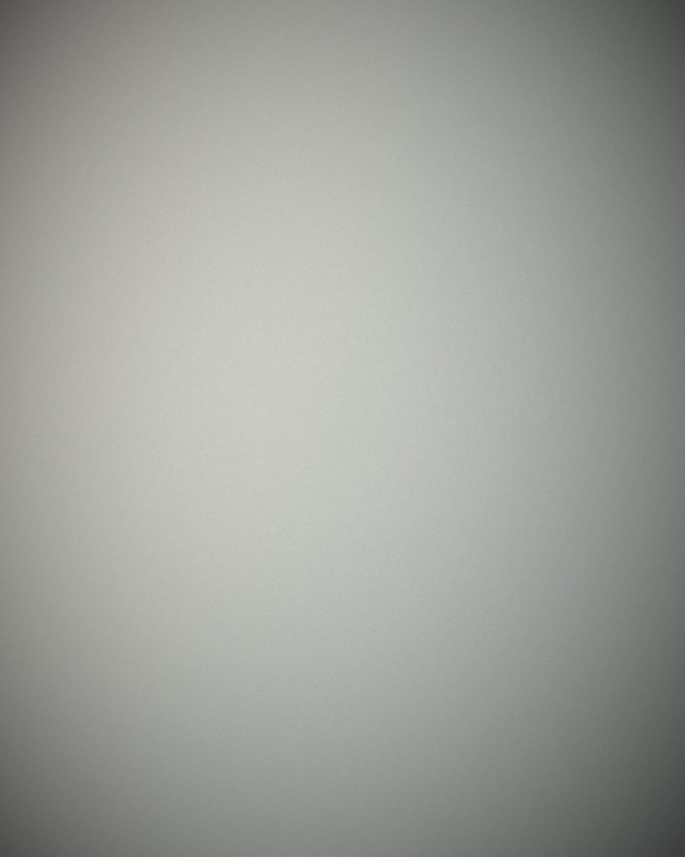 Quiet corner of polished concrete floor and daylight.