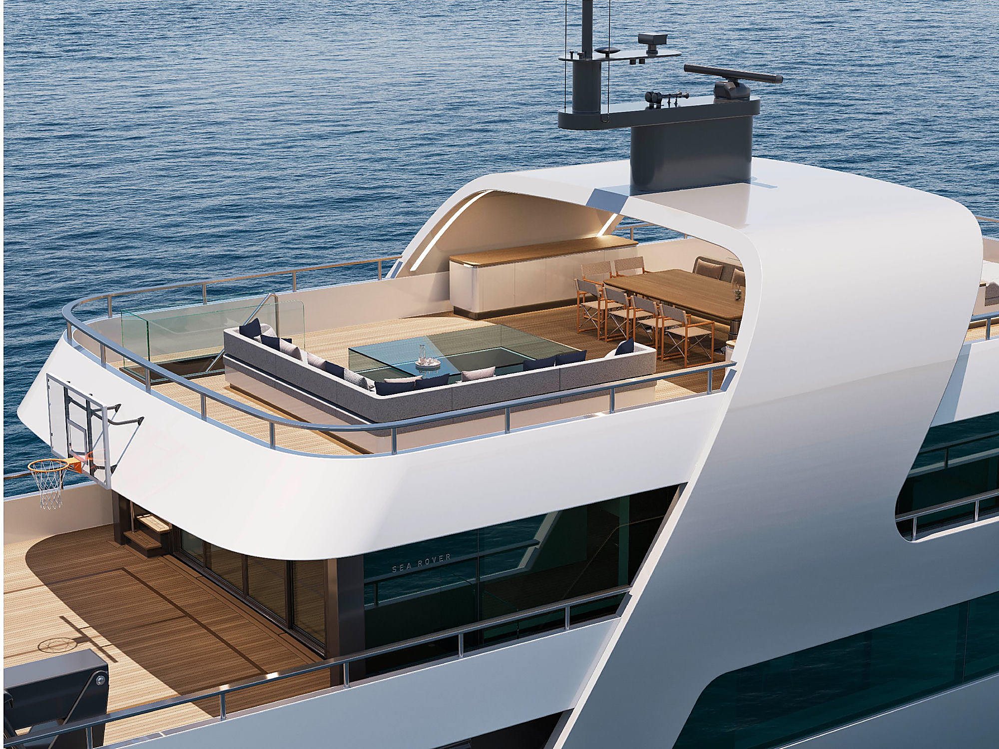 Aerial view of the sundeck showing the Sea Rover nameplate, a basketball hoop, and a cushioned corner lounge.