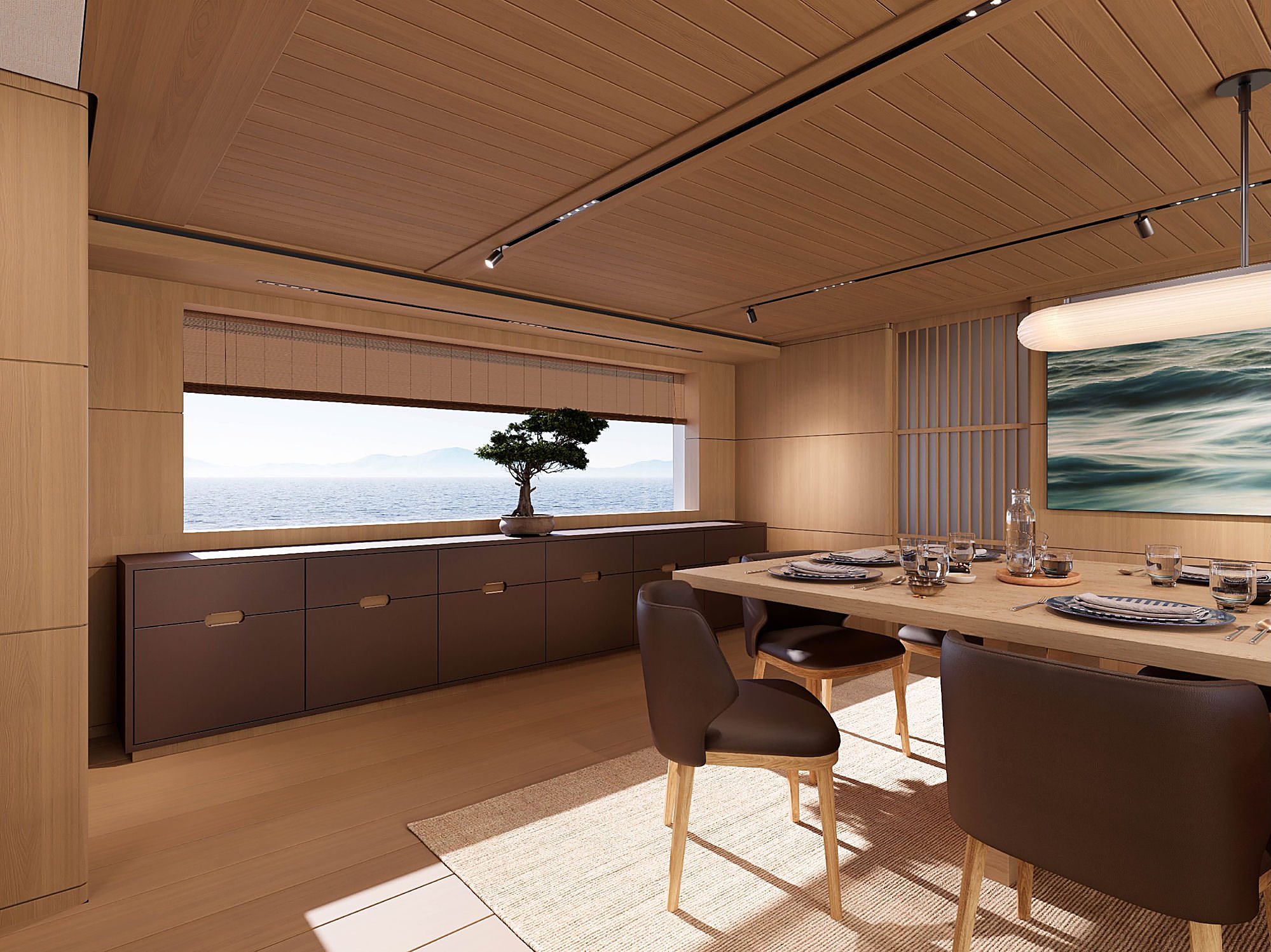 Dining table set for four beneath a woven pendant light, with a bonsai tree on the credenza and ocean visible through the window.